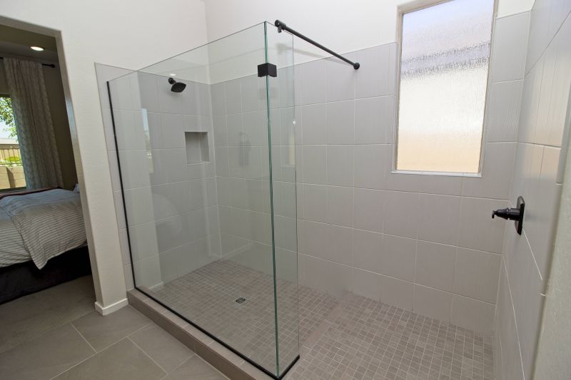 Sleek Glass Shower with Stone Floor